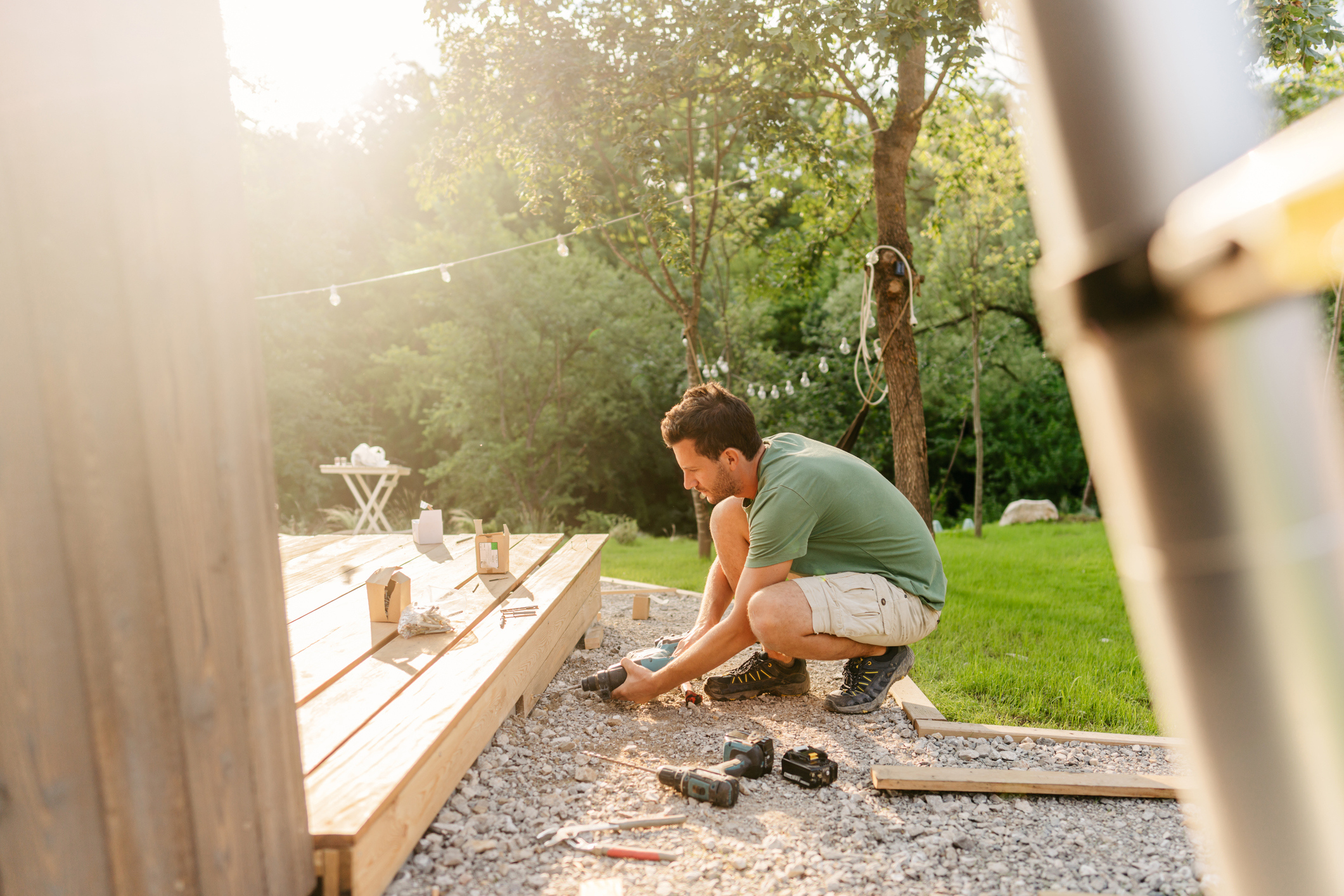 Man installing a deck for his home.