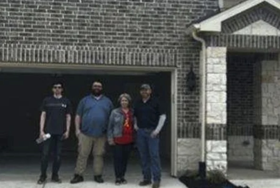 picture of Billy R. in front of a house